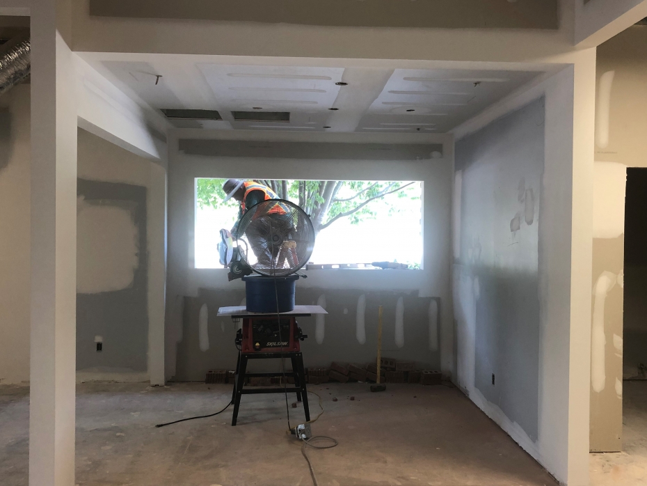 Photo of a construction worker framing a window at Richland Library Lower Richland.